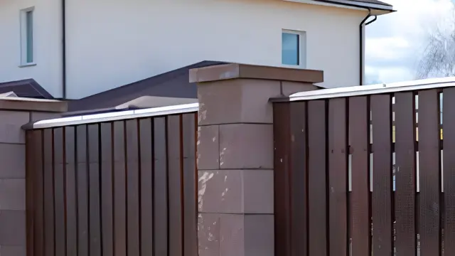 Brown Privacy Fence Modern Home - Fence Cleaning Wilmington, NC Brown wooden privacy fence with stone pillars beside a modern white home