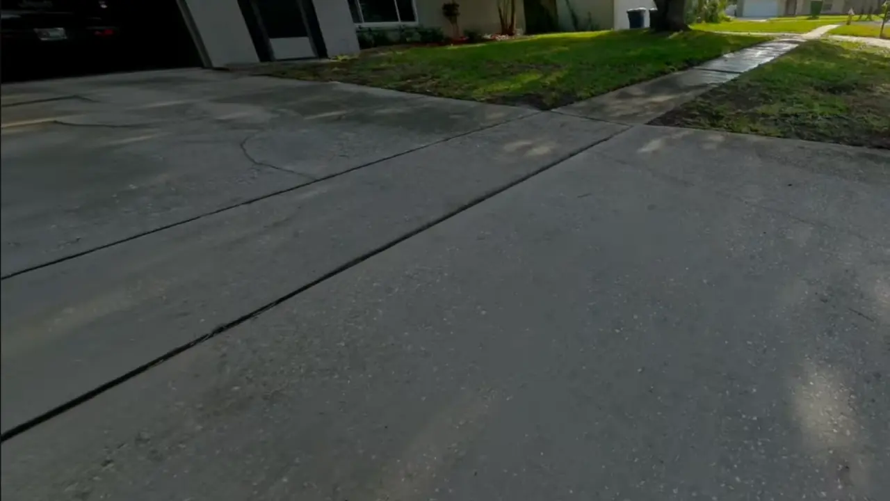 Clean Concrete Driveway - Driveway Cleaning Wilmington, NC Clean gray concrete driveway leading up to a home