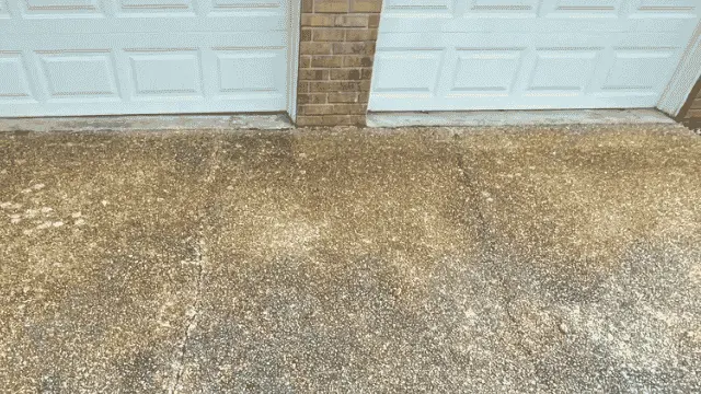 Stained Aggregate Driveway Garage Doors - Driveway Cleaning Wilmington, NC Stained exposed aggregate driveway in front of two garage doors - Driveway Cleaning Wilmington, NC