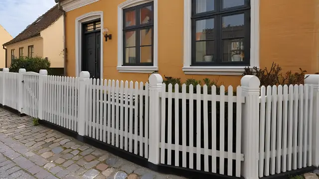 White Picket Fence Yellow House - Fence Cleaning Wilmington, NC Bright white picket fence in front of a yellow house - Fence Cleaning Wilmington, NC